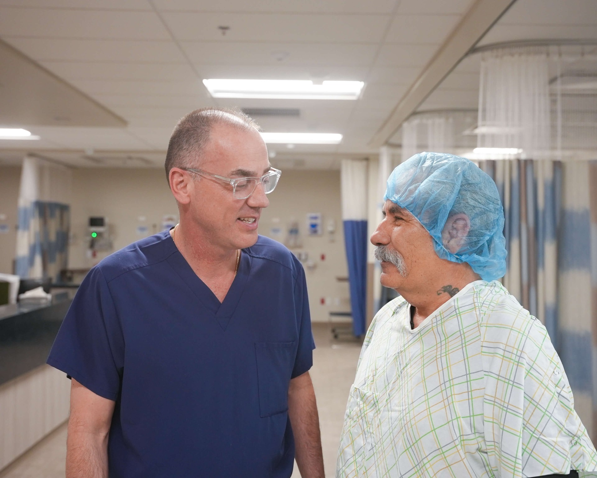 ABQ Surgery Center surgeon speaking with a patient before their procedure